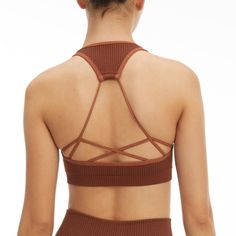 New Year, New You. Meet The Seamless Strappy Back Rib Bra. Innovative Workout Fabrication For The Smoothest Shape And Fit Yet. Pair It With The Seamless Ribbed Legging For The Full Look. Square Neckline Strap Back Ribbed Textured Seamless Construction Medium Support Padded Brown Color 93% Nylon 7% Elastane Care: Machine Wash Cold Gentle Cycle. Tumble Dry Low S/M Order Size 1/2 Brown Stretch Crop Top With Built-in Bra, Fitted Seamless Brown Sports Bra, Fitted Brown Seamless Sports Bra, Strappy Seamless Yoga Crop Top, Seamless Strappy Yoga Crop Top, Brown Stretch Seamless Tank Top, Brown Seamless Activewear, Sunset Swim, Black Cropped Sweater