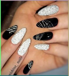 Looking for the best black Christmas nail ideas? Check this post for the best Christmas nail ideas in black color to copy this year. From… New Year Nails Black And Silver, Nye Nails Black And Silver, Black Glitter Christmas Nails, Black Silver Glitter Nails, Christmas Nails Elegant Silver Glitter, Black Sparkle Nail Designs, Black And Silver Nails Almond, Black And Silver Christmas Nails, Black Nails With Silver Design