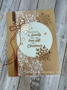 a handmade christmas card with the words friends and family true love on it, surrounded by snowflakes