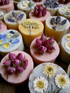 many different types of soaps with flowers on them