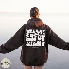 Retro-Inspired Faith Hoodie | Walk By Faith Not By Sight | 2 Corinthians 5:7 | Unique Christian Apparel | Groovy Bubble Font Design | Comfortable and Stylish | Perfect Inspirational Gift | High-Quality Material | Available in Multiple Sizes | Spread Faith and Positivity PLEASE CHECK THE SIZE GUIDE IN THE PICTURES! 👉PRODUCTION TIME 2-5 business days 🚚 SHIPPING TIME USPS 1-5 business days ↩️RETURNS - We do not accept returns unless items are somehow damaged. This is due to our shirts being made- Inspirational Hoodie For Fall Streetwear, Inspirational Fall Streetwear Hoodie, Inspirational Letter Print Hoodie For Fall, Inspirational Hoodie Sweatshirt For Fall, Inspirational Graphic Print Hoodie For Fall, Inspirational Hooded Sweatshirt For Fall, Inspirational Fall Hoodie Sweatshirt, Inspirational Hooded Fall Sweatshirt, Inspirational Long Sleeve Hoodie For Fall