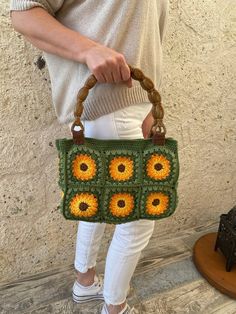 Granny Square Boho Bag, This colorful and stylish crochet boho bag is the perfect accessory for any fashion-forward individual who loves unique and handmade items. It's versatile and functional, serving as summer clutch and handbag to accommodate all your belongings. Measurements: ♥Width: 28 cm ♥Height without handles: 20 cm ♥Total height with handles:39 cm  It has acrylic handle Green Square Crochet Bag, Green Crochet Bag With Granny Square For Daily Use, Green Hand-knitted Crochet Tote Bag, Green Crochet Granny Square Bag For Everyday Use, Green Granny Square Crochet Bag For Everyday Use, Green Rectangular Crochet Bag With Handles, Summer Green Crochet Bag With Granny Square, Green Handheld Crochet Bag With Handles, Green Crochet Tote Bag