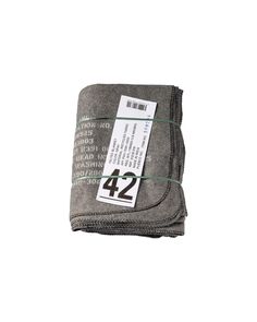 the number 42 label is attached to two pieces of gray fabric with green thread on each side