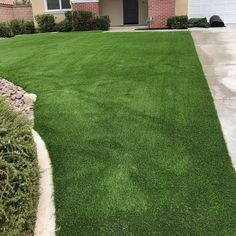 a house with green grass in front of it