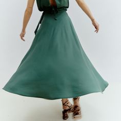 This midi, A-line wrap-skirt in Forest Green is a versatile and stylish addition to any wardrobe. You can tie it up at the side to achieve your desired look, while the adjustable waistline ensures a perfect fit from sizes XS to L. Made of 100% soft and breathable Tencel, this skirt offers both comfort and breathability. Consciously produced in our own atelier in Romania in limited quantities. 100% Tencel. Wash at 30 degrees, medium heat ironing. Our recommendation for washing clothes is to use either a mild detergent or one specifically designed for wool and silk fabrics. Conventional "color detergents" often contain enzymes that can break down the fibers or fade the colors. While they may work well with cotton, they have the opposite effect on cellulose fibers, which are commonly used in Animal Print Party, Knit Loungewear, Corporate Chic, Stocking Fillers For Her, Silk Fabrics, Holiday Party Outfit, Independent Designers Fashion, Wrap Skirt, Bridal Collection