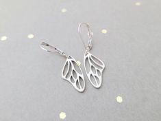 "These earrings are the perfect size, not to big, not too small! The butterfly wing pattern also harkens the organic shape of a seashell. You choose sterling silver french wires or leverbacks. Earrings measure 1 3/8\" long These earrings will arrive in a small zip lock bag, as well as a decorative organza bag. It is recommended that the earrings are kept in the bag when not being worn to keep them nice and shiny. Of course, a quick polish will always work too :-) More earrings can be found here: Hypoallergenic Sterling Silver Butterfly Earrings, Sterling Silver Earrings With Butterfly Charm, Sterling Silver Butterfly Earrings With Ear Wire, Butterfly Wing Pattern, Butterfly Wings Pattern, Wing Pattern, Zip Lock Bag, Earrings Butterfly, Butterfly Wing