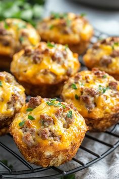 mini cheeseburger muffins cooling on a wire rack with parsley in the background