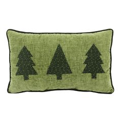 a green pillow with three trees on the front and one tree on the back in black