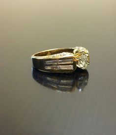 a diamond ring sitting on top of a table