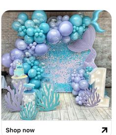 a mermaid themed birthday party with balloons and decorations