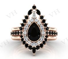 a black and white diamond ring set in 18k rose gold with an oval center stone