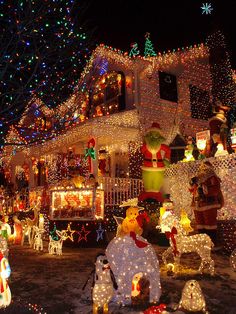 a house covered in christmas lights and decorations