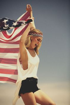 a woman holding an american flag in front of her head and the words teenagers on it