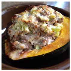 a stuffed squash with meat and vegetables on it