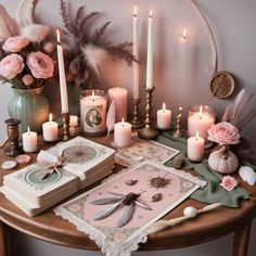 a table topped with lots of candles and cards