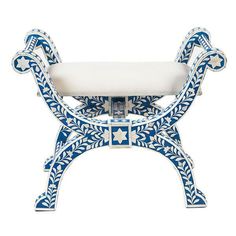 a blue and white bench with an intricate design