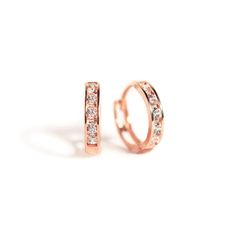 These Rose Gold Vermeil Huggie Hoop earrings will be your favorite everyday pairs. Our Huggies are true to size and will hug your ear perfectly. Great for smaller lobes or second piercings. 14K Rose Gold over Sterling Silver Cubic Zirconia Crystals Hypoallergenic, lead and nickel free Thickness 2mm Inside Diameter Sizes: 6.5mm, 9mm Snap closure #E008-RG Second Piercing, Types Of Piercings, Helix Piercing, Huggie Hoop Earrings, Cartilage Earrings, Rose Gold Earrings, Shop Earrings, Gold Vermeil, Gold Earrings