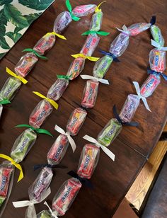 some candy wrapped in plastic sitting on top of a wooden table