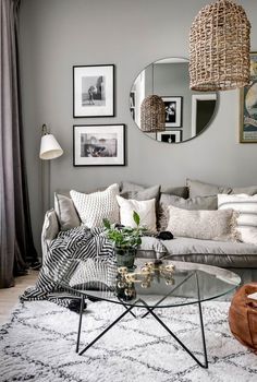 A small Scandinavian apartment that feels airy and super stylish Mirror Wall Decor Small Living Room, Light Grey And White Living Room, Living Room With Light Grey Walls, Circular Mirror Living Room, Light Grey Apartment, Scandinavian Living Room Grey, Grey And White Interior, Grey And White Home, Light Grey Living Room