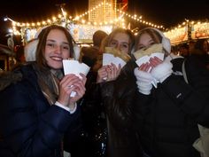 three young women are posing for the camera while holding paper napkins in their hands