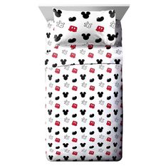 mickey mouse bedding set with red and black polka dots on the sheets, in front of a white background