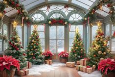 christmas trees are decorated with red and gold ornaments in front of a large glass window