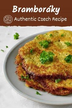 two fritters on a plate with parsley sprinkled on top and the words, bramboaky authentic czech recipe