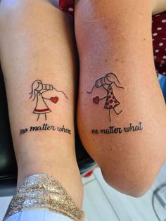 two people with matching tattoos on their legs, one has a heart and the other has a