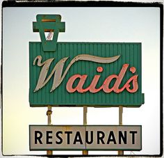 a neon sign for a restaurant called ward's