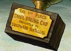 a sign that says the 1st place snail racing cup presented to edward tortelli