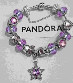 AUTHENTIC Pandora Barrel Clasp Bracelet are purchased from Pandora and come with a receipt. While I use high quality beads and charms on the Pandora bracelet,  the charms and beads used on the bracelet are NOT Pandora Brand, making the bracelet very affordable.  Beads and charms include: Purple single core diamond faceted beads,  Purple heart bead, purple round bead, silver plated Purple crystal Star charm Includes  security bead Clasp Bead  Gift box and ships USPS Priority Mail Pandora Bracelet Affordable Purple Heart Bracelets, Elegant Purple Beaded Charm Bracelet, Purple Charm Bracelet Gift, Purple Charm Bracelet Jewelry, Charm Bracelet With Spacer Beads As Gift, Purple Charms Bracelets For Jewelry Making, Purple Crystal Bracelet For Jewelry Making, Purple Heart Beads Bracelet, Elegant Purple Bracelets With Heart Beads