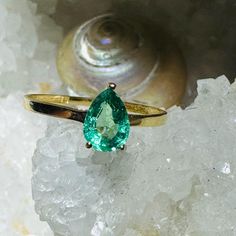 A beautiful natural earth mined emerald set in a solid 18K yellow gold setting. Marked 18K 14k Gold Hallmarked Green Emerald Ring, Hallmarked 14k Gold Green Emerald Ring, Classic Gold Ring With Tsavorite, Classic Yellow Gold Tsavorite Ring, Classic Green Pear-shaped Ring, Classic Yellow Gold Tsavorite Emerald Ring, Heirloom Green Emerald Solitaire Ring, Classic Pear-shaped Green Ring, Green Pear-shaped Emerald Ring For Anniversary