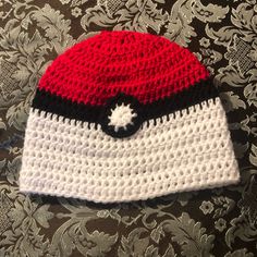 a crocheted hat with the word poshmark on it