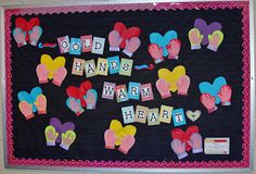 a bulletin board with words written on it and hearts in the middle that spell out cold hands warm heart