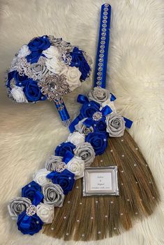 blue and white bridal bouquet with matching hair comb, brooch and photo frame