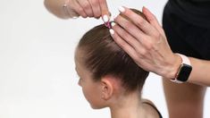 a woman is getting her hair done at the same time