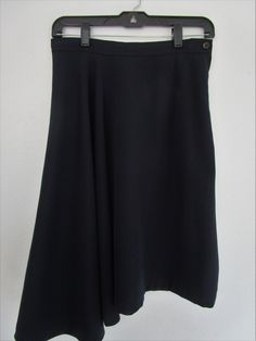 "Authentic dark navy blue skirt from Comme de Garcons, Japanese fashion label founded and headed by Rei Kawakubo in Tokyo and Place Vendôme in Paris. Amazing draped balance. Left side is A line with darts and side YKK zipper and waistband button opening. Right side drops longer and is circle flaired and falls into perfect folds, Hi lo hem lengths. Made in Japan. 55% Poly 45% Wool gaberdine woven. Condition: Very good gently preowned condition. Freshly dry cleaned. Even flat color, no issues. See Navy Flowy Skirt For Work, Navy Blue Skirt, Rei Kawakubo, Hem Skirt, Ykk Zipper, Flat Color, Blue Skirt, Dark Navy Blue, Red Hats