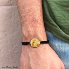 "Unisex Phaistos Disc Bracelet by Irene Andrea Jewelry The \"Phaistos Disc\" is a disk of fired clay from the Minoan palace of Phaistos, possibly dating between 1950 BC and 1400 BC, the middle or late Minoan Bronze Age! It was discovered in the basement of room XL-101 of the Minoan palace-site of Phaistos, near Hagia Triada, on the south coast of Crete. Italian archaeologist Luigi Pernier recovered this remarkably intact 'disk', about 15 cm in diameter and uniformly just over 1 cm thick, on July Handmade Adjustable Gold Bracelet, Handmade Adjustable Spiritual Gold Bracelet, Adjustable Spiritual Gold Jubilee Bracelet, Greek Bracelet, Disc Bracelet, Greek Jewelry, Men's Bracelet, Unisex Bracelets, Bronze Age