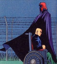 a man in a wheelchair with a cape over his head