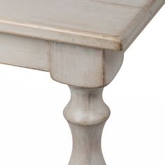 an old white table with wooden legs and wood grained finish on the top, isolated against a white background