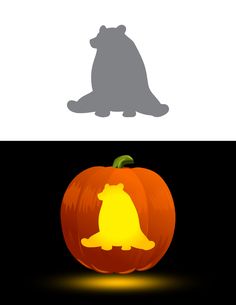 a cat sitting on top of a pumpkin in the shape of a dog with its eyes closed