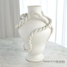 A quick sketch of Ashleys on a recent trip to Italy was the inspiration behind our Twisted Vases. Meticulously made by hand in our Italian ceramics studio, these pieces are truly a modern work of art. The twisted vine details, large scale, and chalk-matte glaze create an heirloom quality that is classic, current and chic all at the same time. Dimensions Overall 22.5"H x 17.75"Dia. (23 lbs)  Dust with dry soft cloth. Product is Watertight Ashley Childers, Ceramics Studio, Trip To Italy, Global Views, Italian Ceramics, Ceramic Studio, White Vases, Quick Sketch, Vase Design