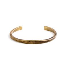 Solid brass cuff with a slim profile and a flat face Hand-forged, contoured silhouette with a slimmer flat face and tapered edges Available in a work patina or high-polish finish Approximate Measurements: 6 mm at widest point, 4 mm at thickest point Small: 6" wrist, Medium: 6.5" wrist, Large: 7" wrist, XL: 7.5" wrist. This cuff is left uncoated and will evolve with wear. Before leaving our shop, each item is stamped with our Studebaker maker's mark and its city of origin, Pittsburgh. Science Jewelry, Flat Face, Brass Cuff, Shop Jewelry, Brass Jewelry, Hand Forged, Makers Mark, Leather Handmade