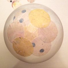 a white ball with circles painted on it