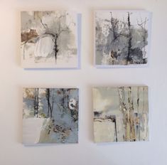 four paintings are hanging on the wall next to each other, one is white and gray