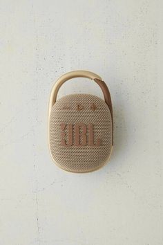 the jbl portable bluetooth speaker is mounted on a wall