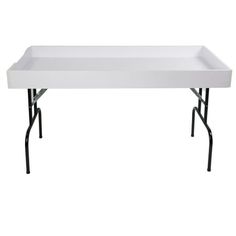 a white table with black legs and a tray