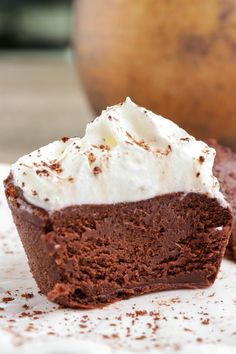 a piece of chocolate cake with whipped cream on top