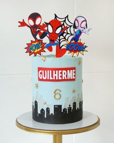 a spiderman themed birthday cake on a gold pedestal with the name gulliherme