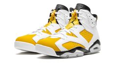 The Air Jordan 6 "Yellow Ochre" is a colorway of Michael Jordan’s sixth signature shoe with a white-and-yellow color scheme.  Featuring the reconizable color block of the original “Carmine” Air Jordan 6, this “Yellow Ochre” colorway replaces all of the red accents with an earth tone shade of yellow.  The yellow hue in question is found on the synthetic nubuck base of the shoe, along with white leather overlays and black detailing throughout.  The Jordan 6’s signature icy translucent rubber outso Yellow Leather Jordan Shoes With Round Toe, Sporty Yellow Leather Jordan Shoes, Yellow Sporty Jordan Shoes In Synthetic Material, Yellow Lace-up Leather Jordan Shoes, Jordan Dunk Low, Wmns Air Jordan 6 Retro 'gold Hoops', Nike Air Jordan 6, All Jordans, Ugg Classic Mini